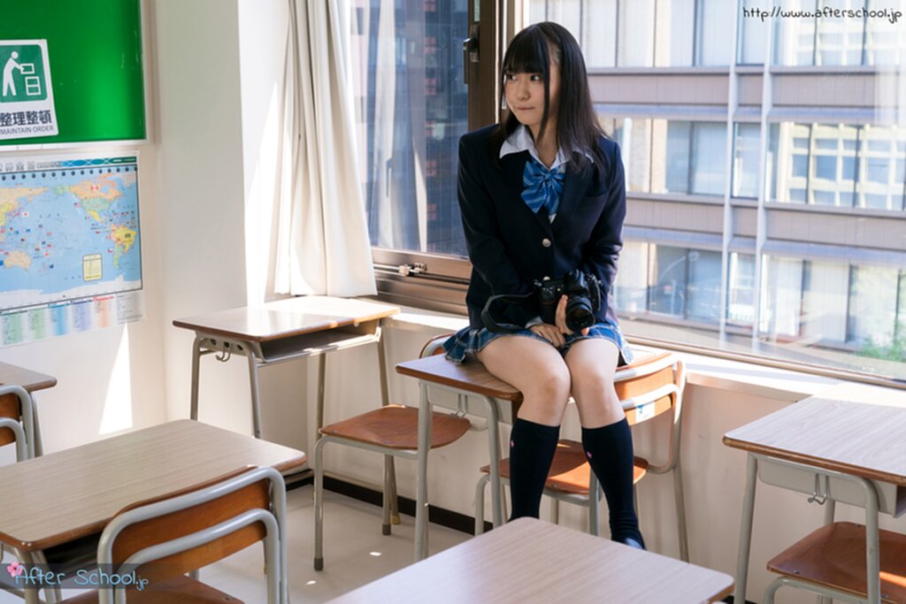 Momoki nozomi sitting on desk in uniform knees pressed together