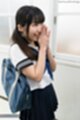 Hands clasped together wearing uniform bag over her shoulder.jpeg