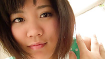 Dark eyes and short hair hand on her shoulder