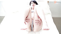 Lying on bed with knees raised bare feet