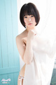 Minori standing behind curtain short hair