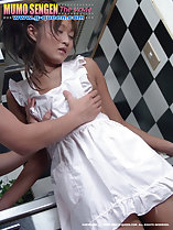 Hands fondling breasts through white apron