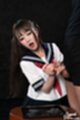 Kogal kneeling wearing uniform stroking cock