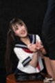 Looking up on her knees wearing uniform giving handjob