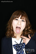 Sticking tongue out fully hand raised
