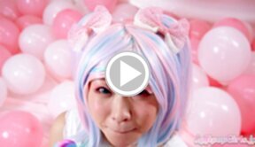 Minano Ai on her knees licking lollipop and sucking cock